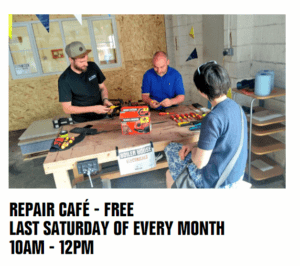 Moss Side Repair Cafe. Last Saturday of the month 10-12. Photograph of volunteers fixing.